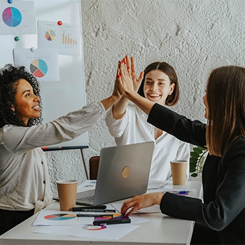 Team of female office workers high five