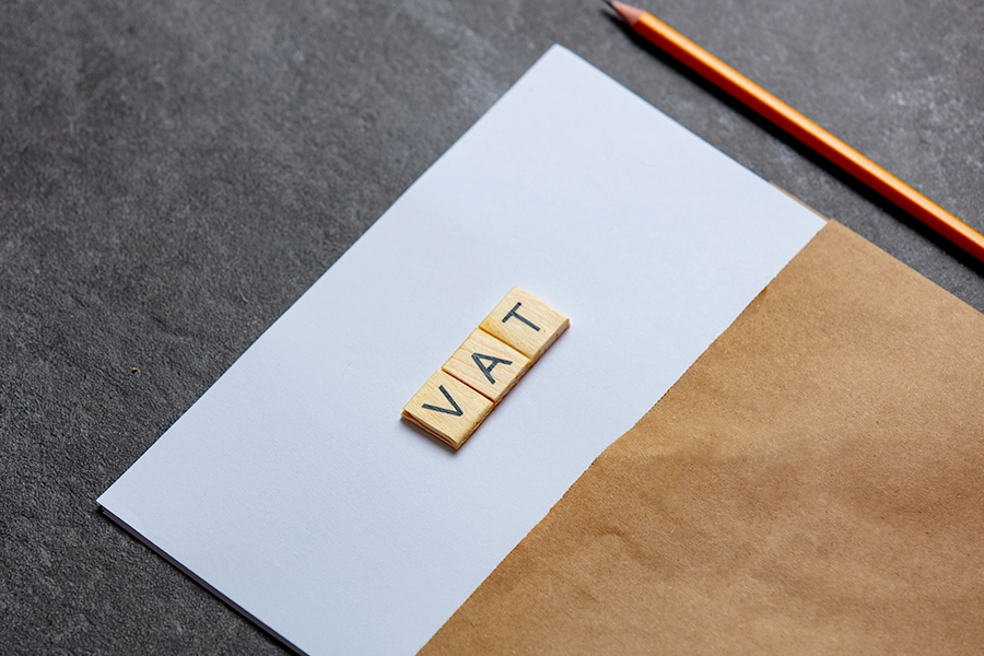 VAT spelt out using individual blocks on a piece of paper